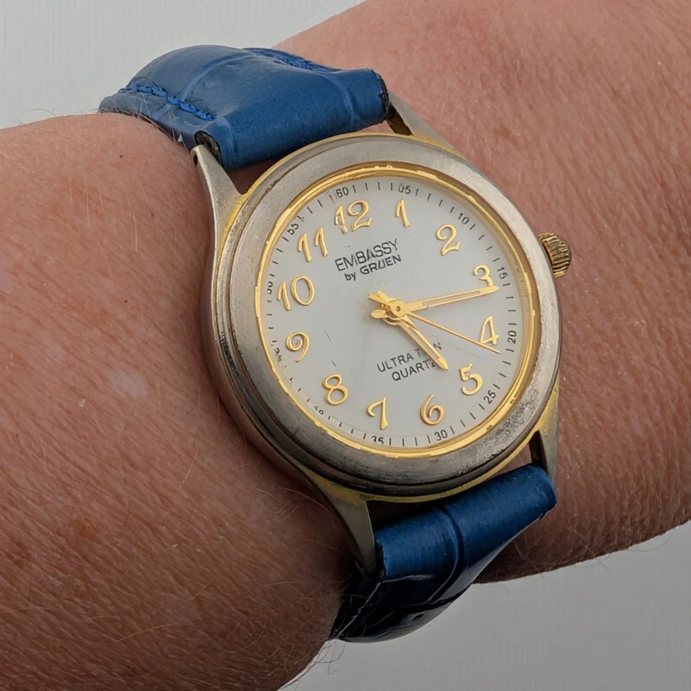Embassy‎ by Gruen Ultra Thin Quartz Watch Gold Tone White Dial Blue Strap W1780